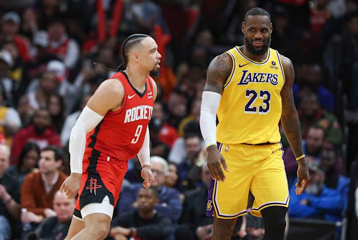 Rockets forward Dillon Brooks reacts toward Los Angeles Lakers forward LeBron James after scoring a basket during the fourth quarter at Toyota Center.